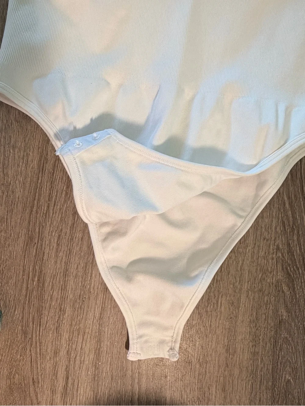 Women’s White Sleeveless One-Piece Bodysuit